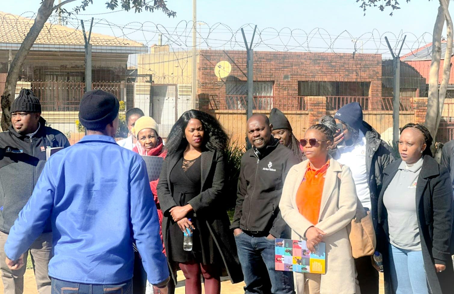 A group of people standing outside a building