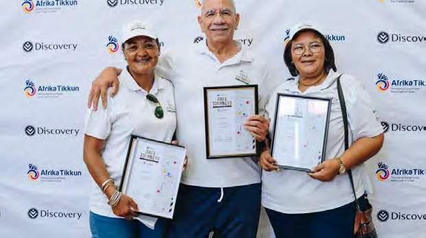 Scholar drivers holding framed Safe Journeys awards