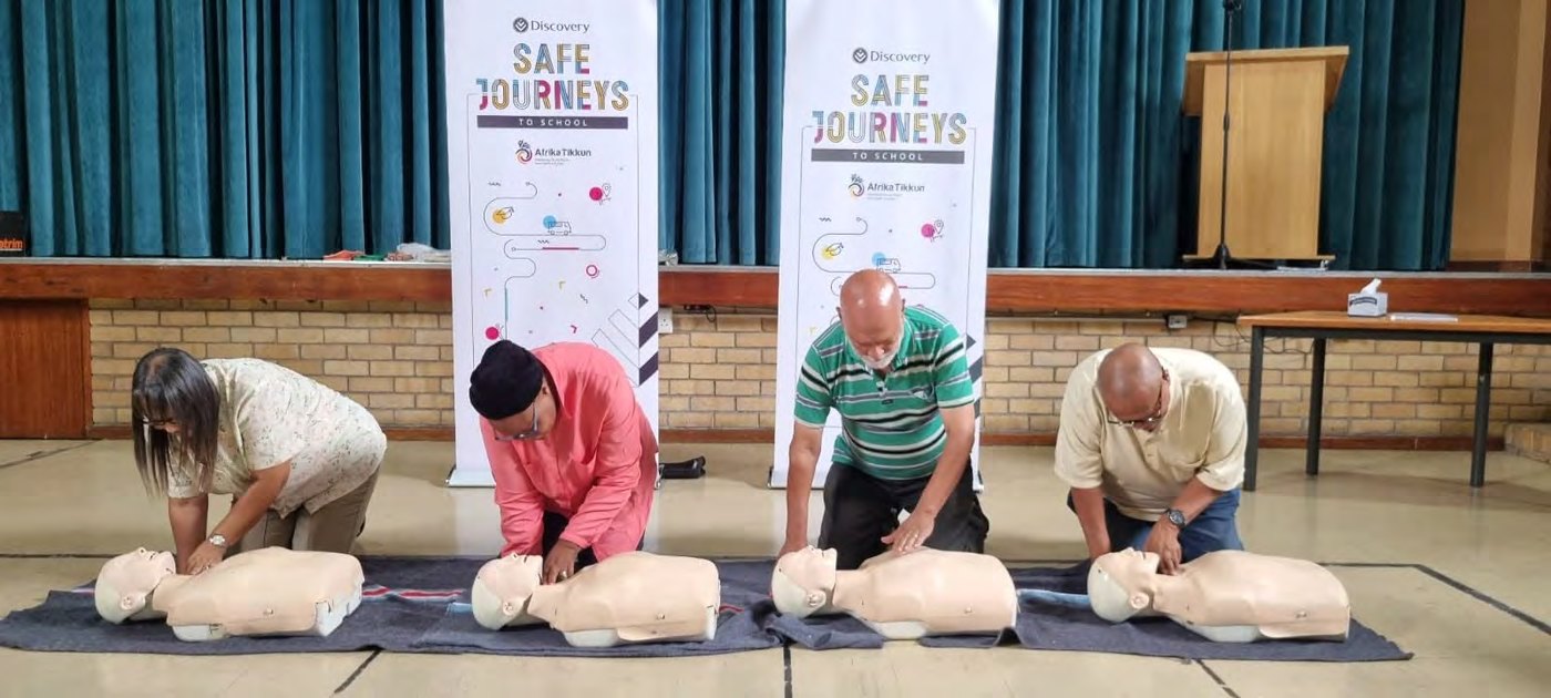 Scholar drivers practising CPR during first-aid training
